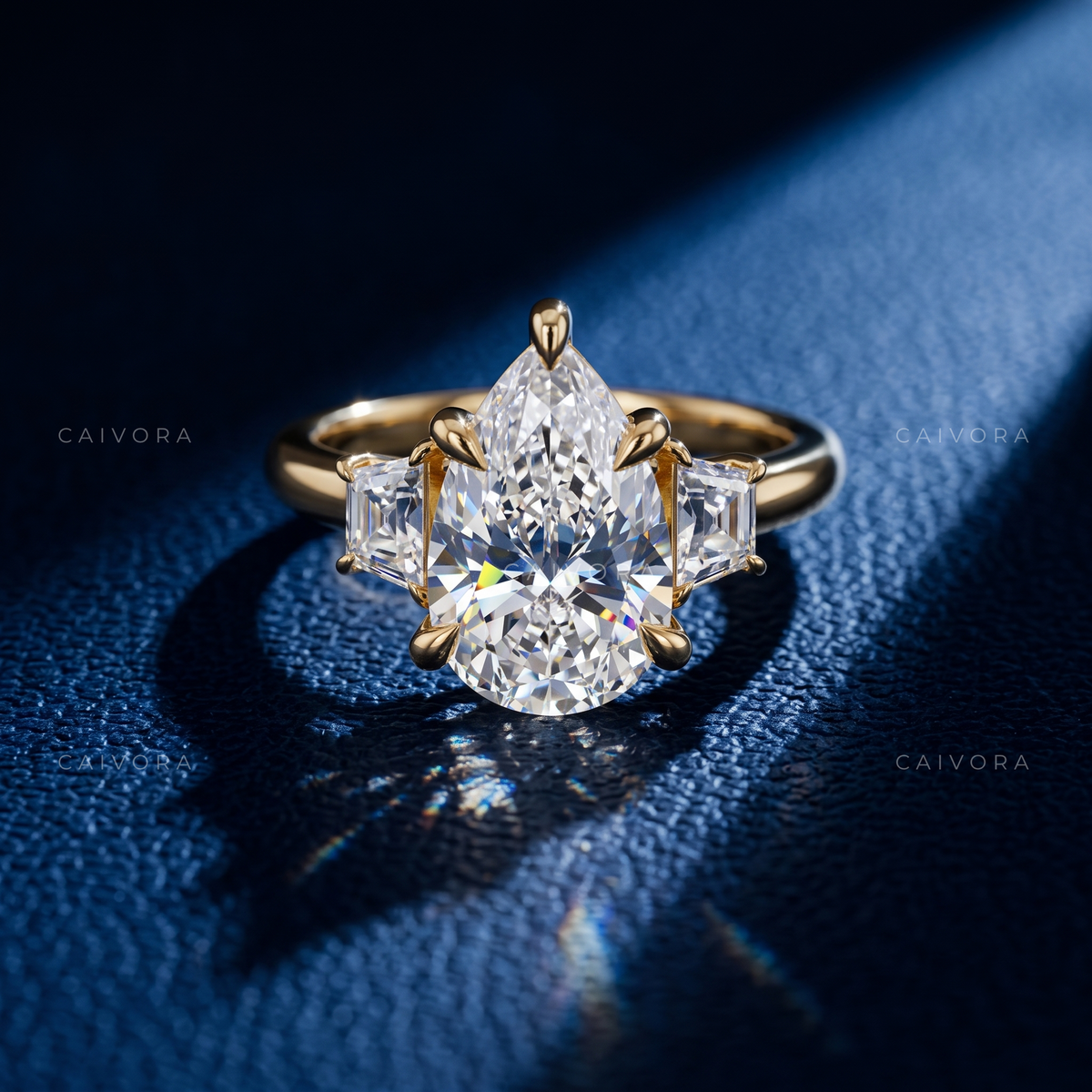 Elegant Three Stone Engagement Ring with Pear Diamond & Trapezoid Accents