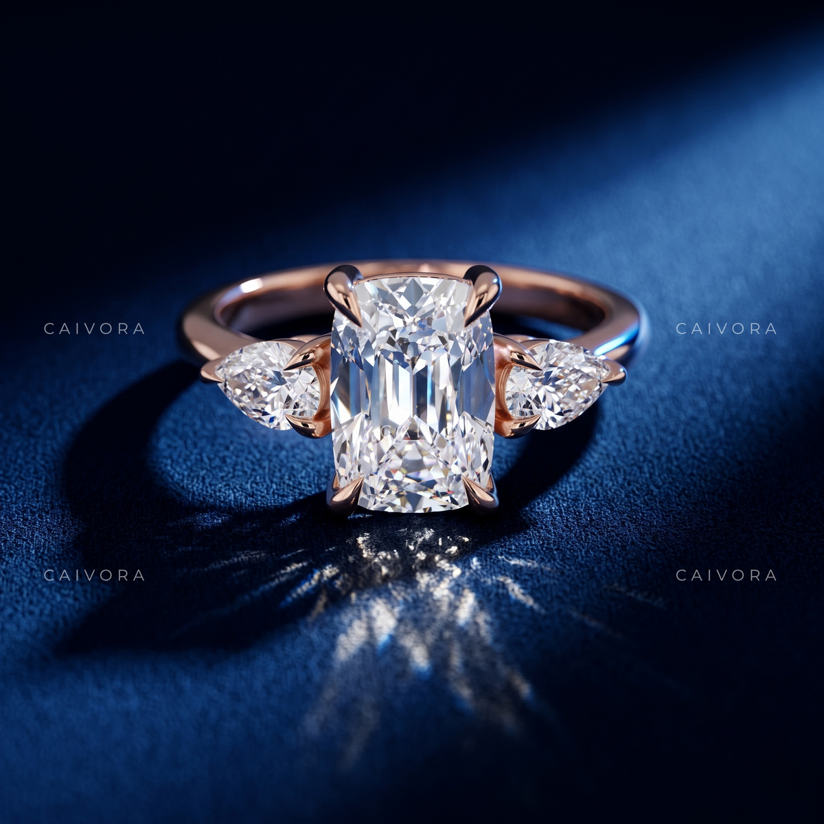 Romantic Three Stone Design Framed by a Cushion Cut Center