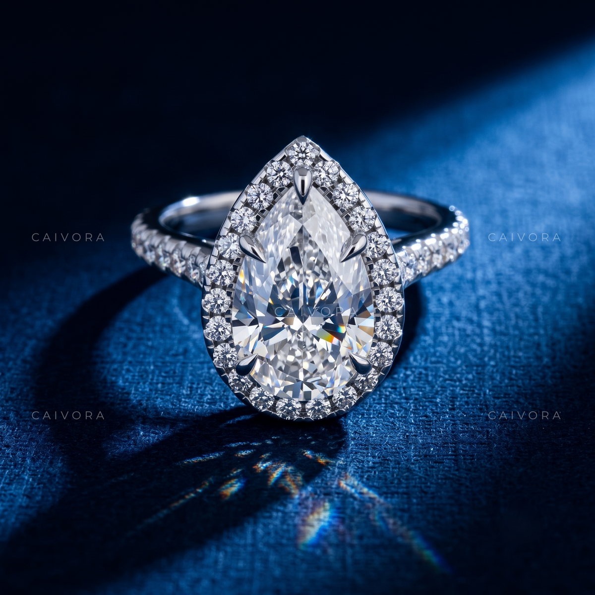 Elegant Halo Engagement Ring with Pear Diamond & Pavé Accents