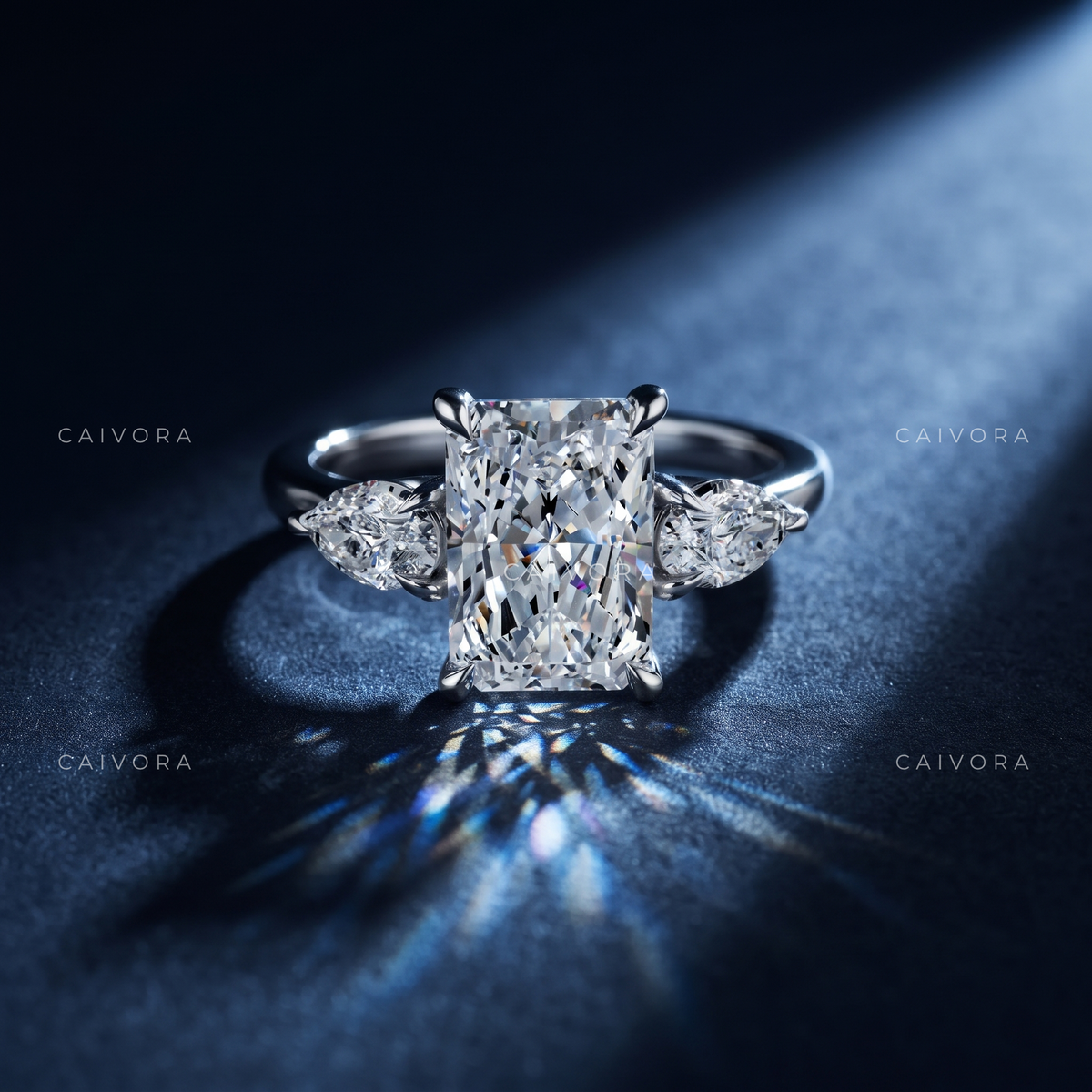 Refined Three Stone Setting Framed by a Radiant Cut Center Diamond