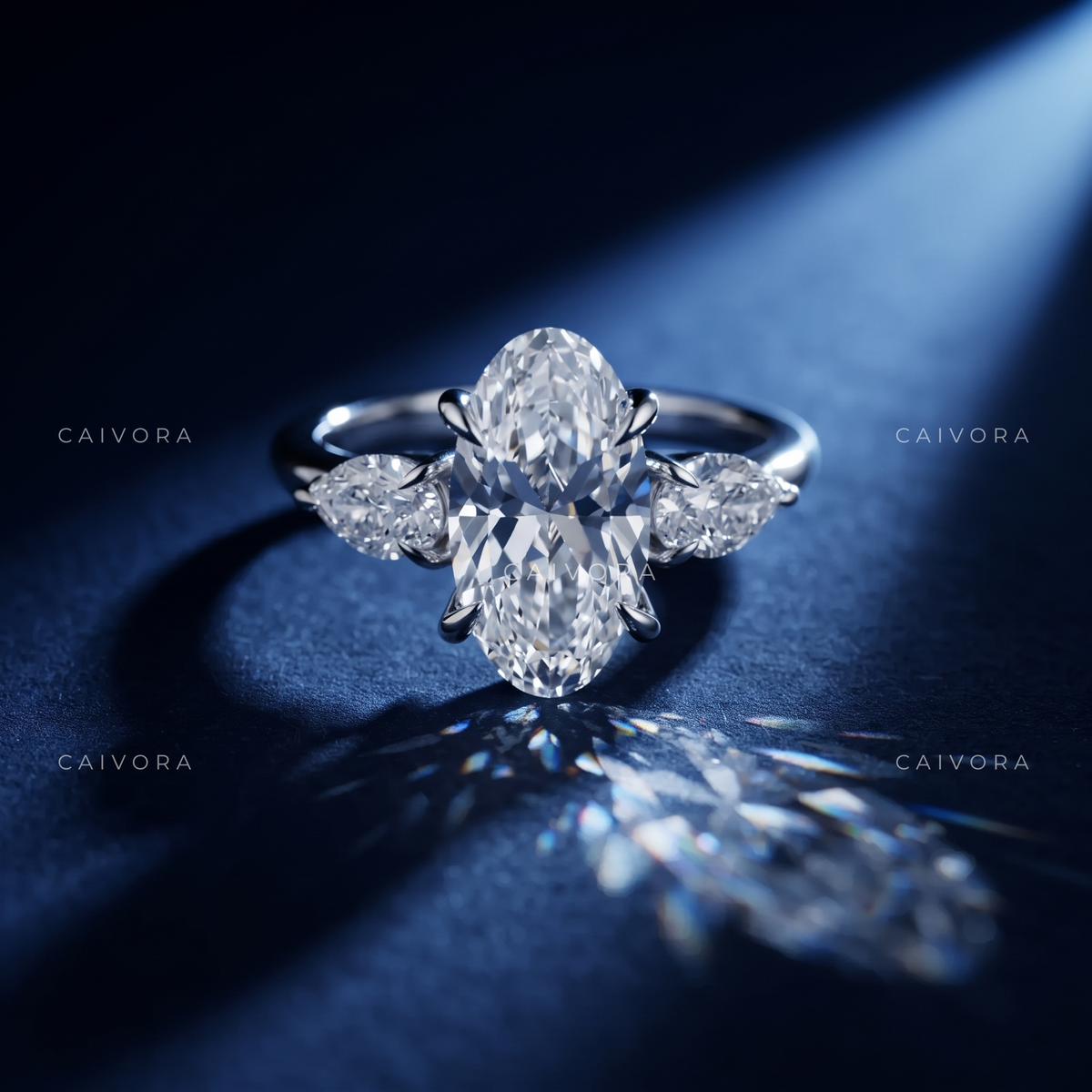 Graceful Three Stone Silhouette with an Moval Cut Center