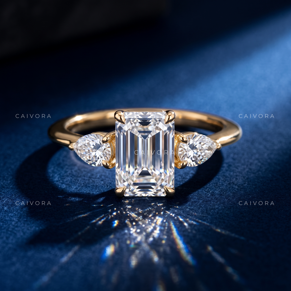 Modern Three Stone Engagement Ring Showcasing an Emerald Cut Center Diamond