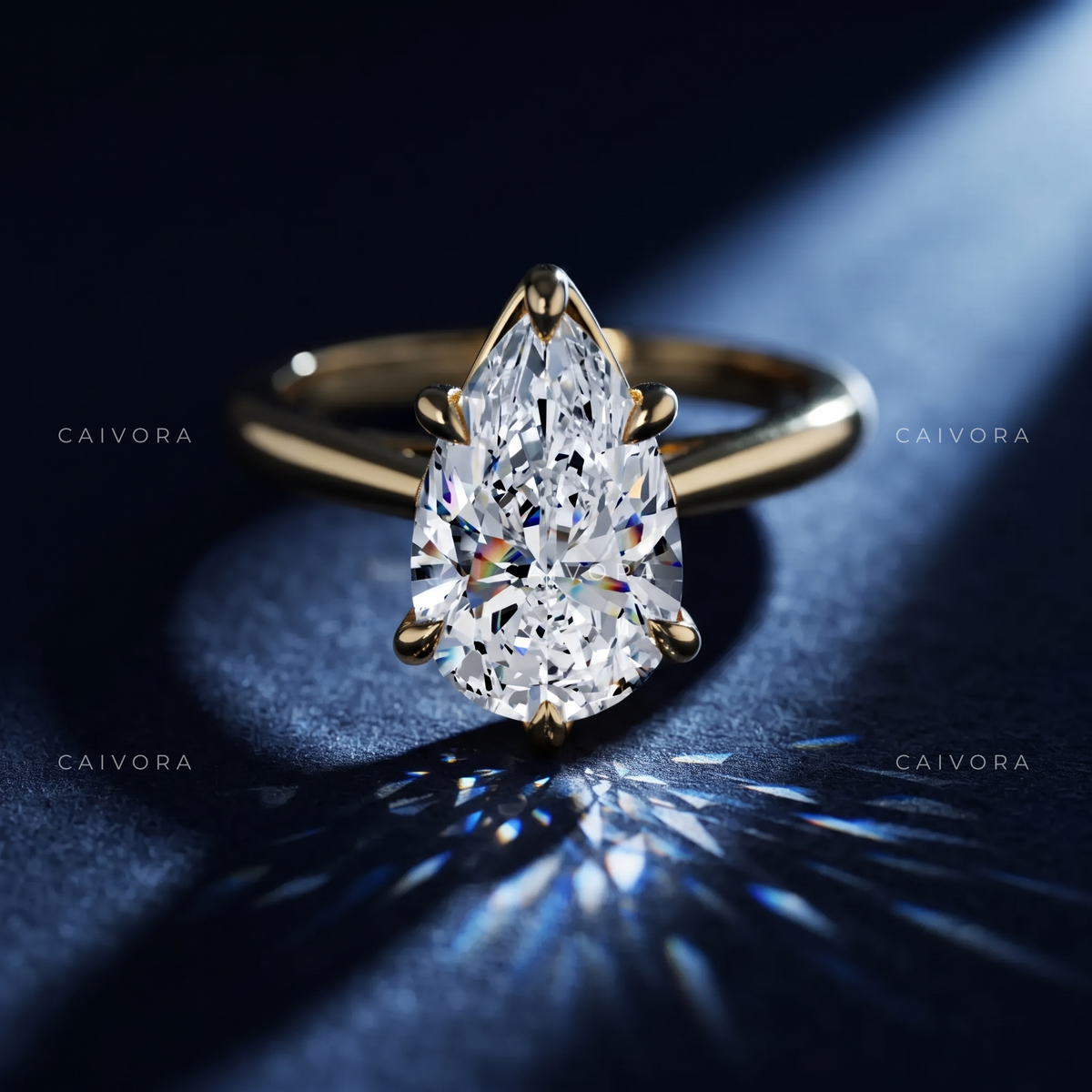 Refined Tapered Cathedral Setting with a Pear Cut Center Diamond