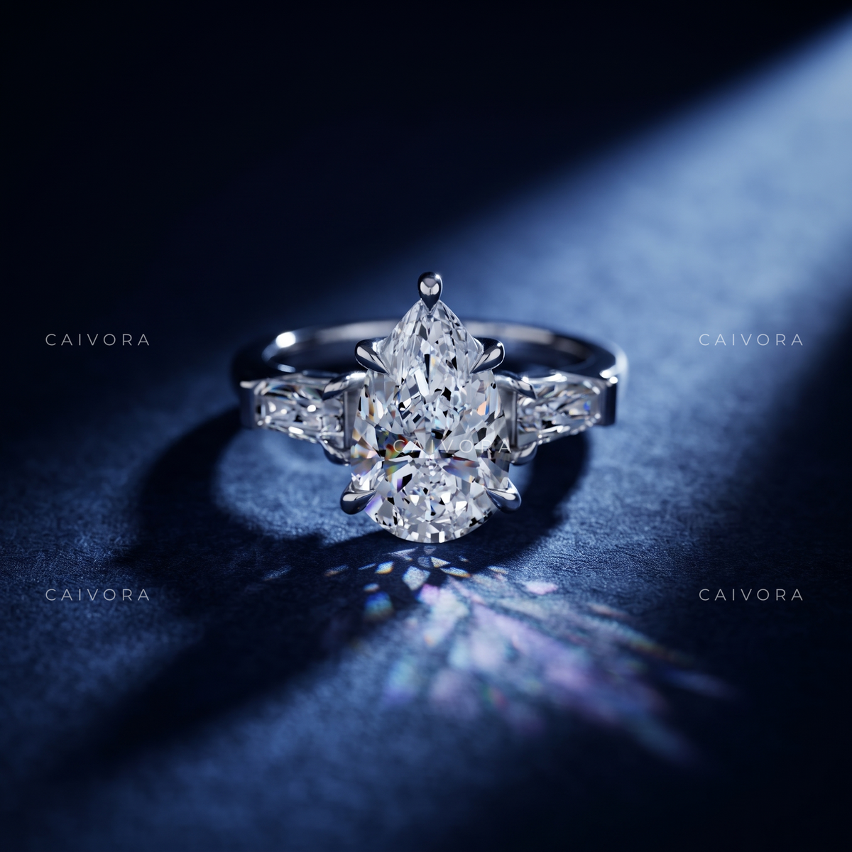 Graceful Contours with a Pear Cut Center Diamond