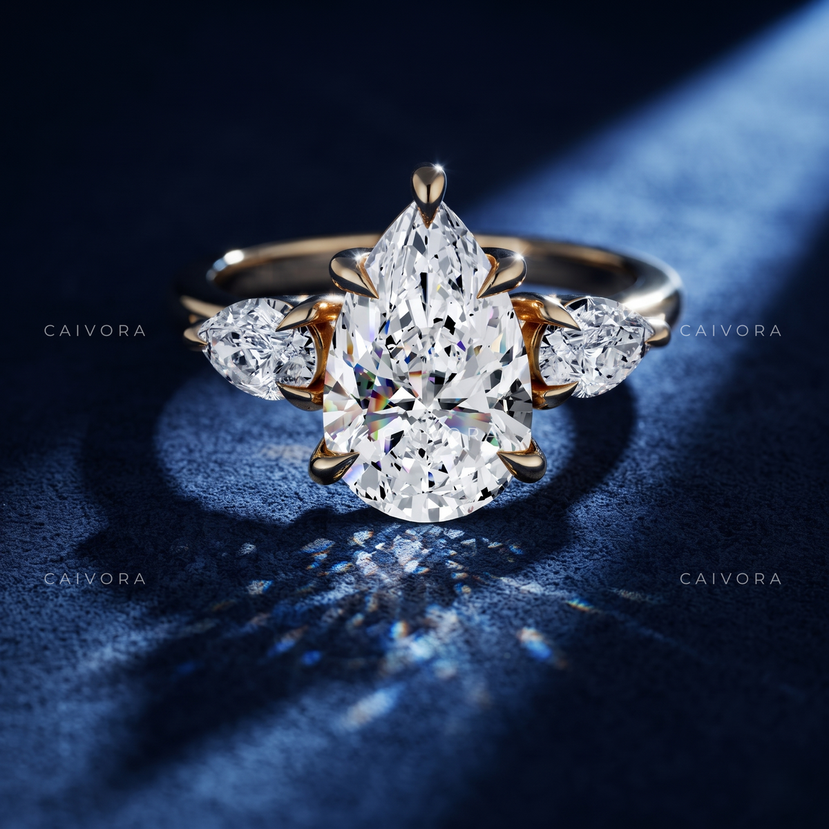 Elegant Three Stone Diamond Setting with a Pear Cut Center