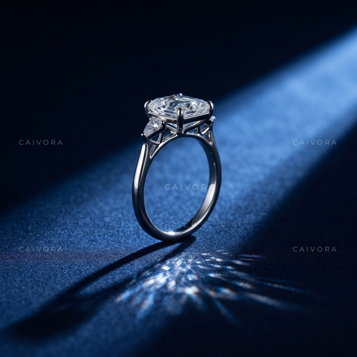 Contemporary Three Stone Engagement Ring with Emerald Diamond & Kite Accents