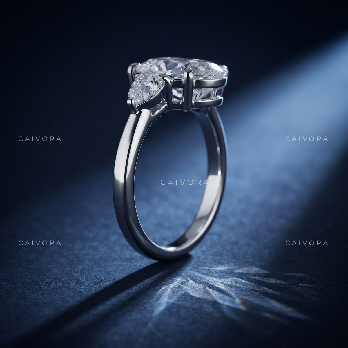Graceful Three Stone Silhouette with an Moval Cut Center