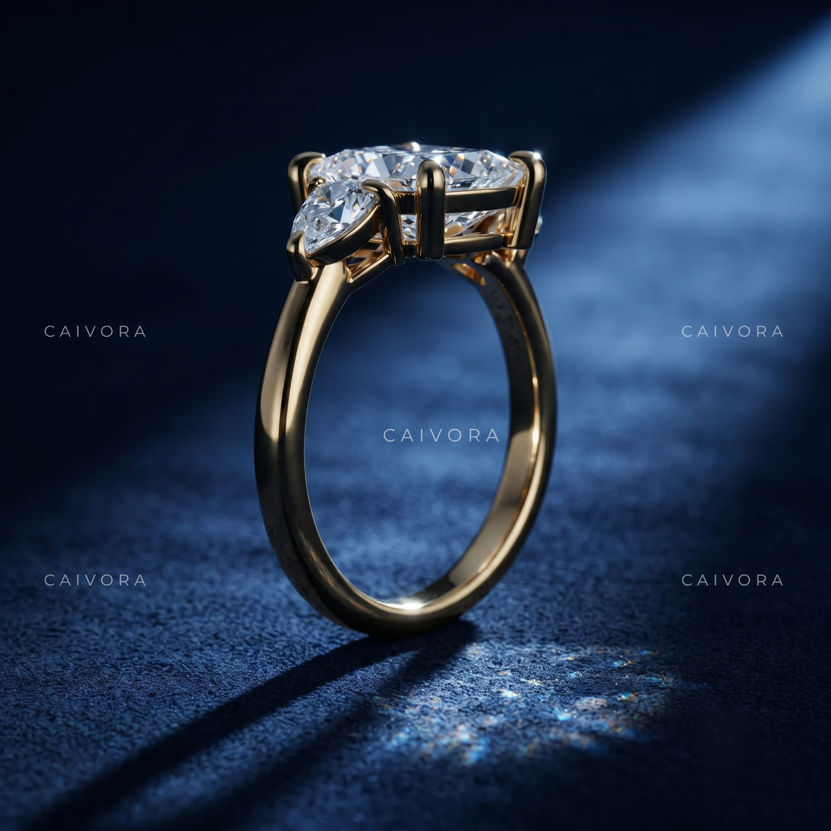 Elegant Three Stone Diamond Setting with a Pear Cut Center