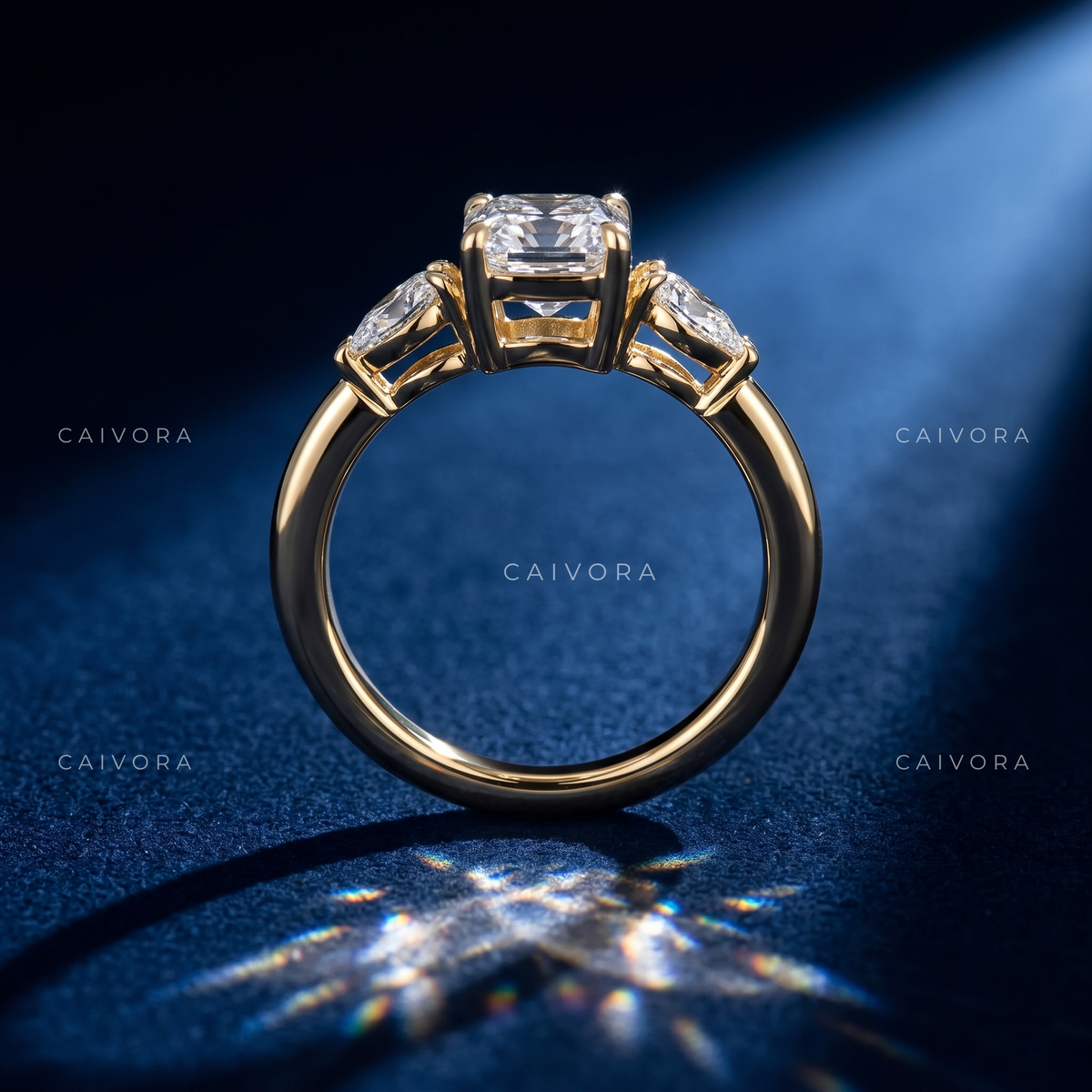 Modern Three Stone Engagement Ring Showcasing an Emerald Cut Center Diamond