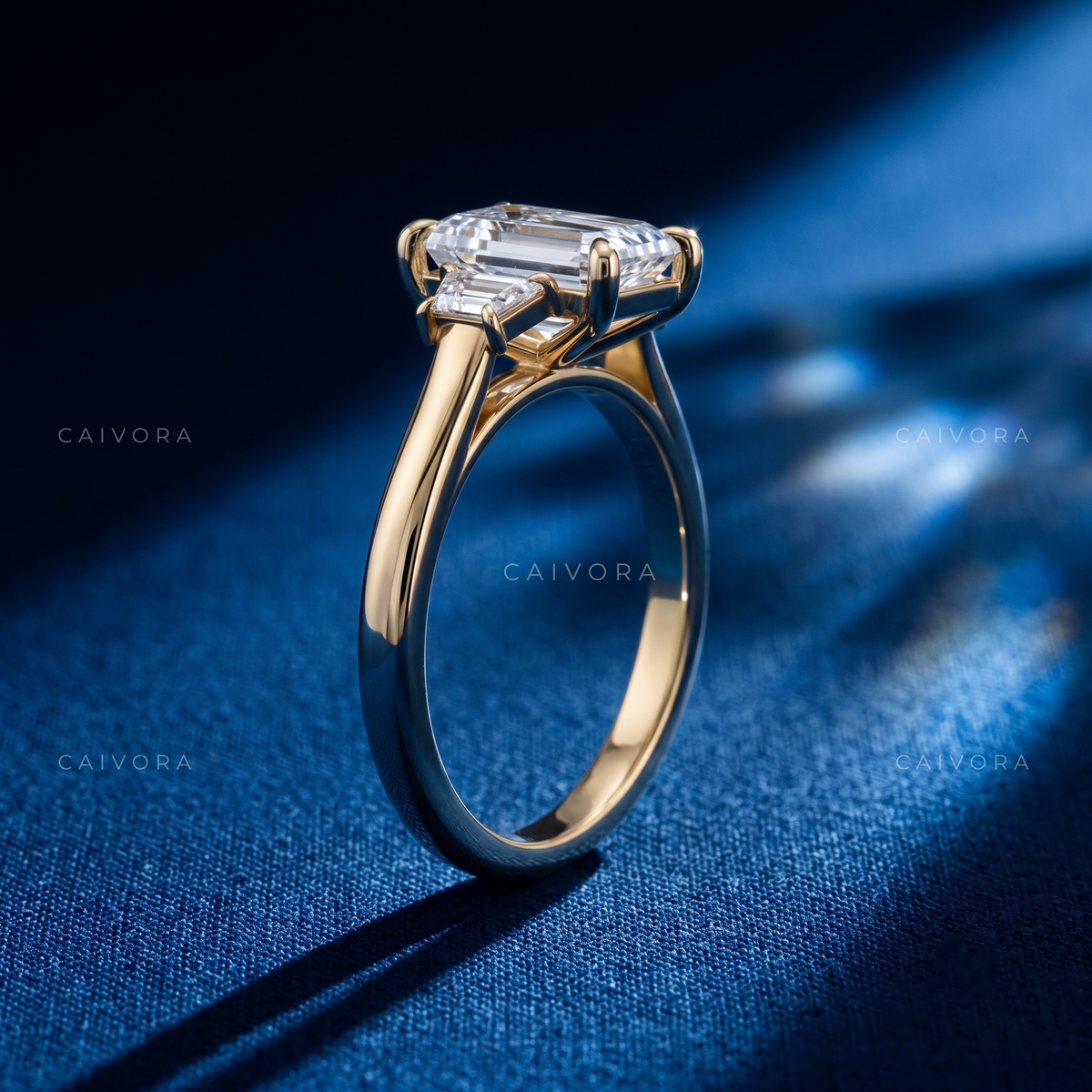 Modern Three Stone Engagement Ring with Emerald Diamond & Trapezoid Accents