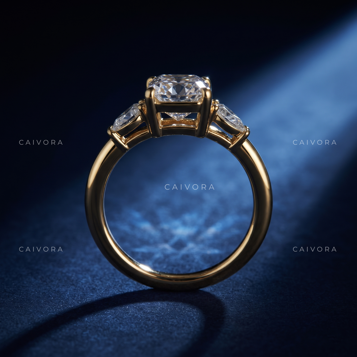 Graceful Three Stone Diamond Ring Featuring a Cushion Cut Center