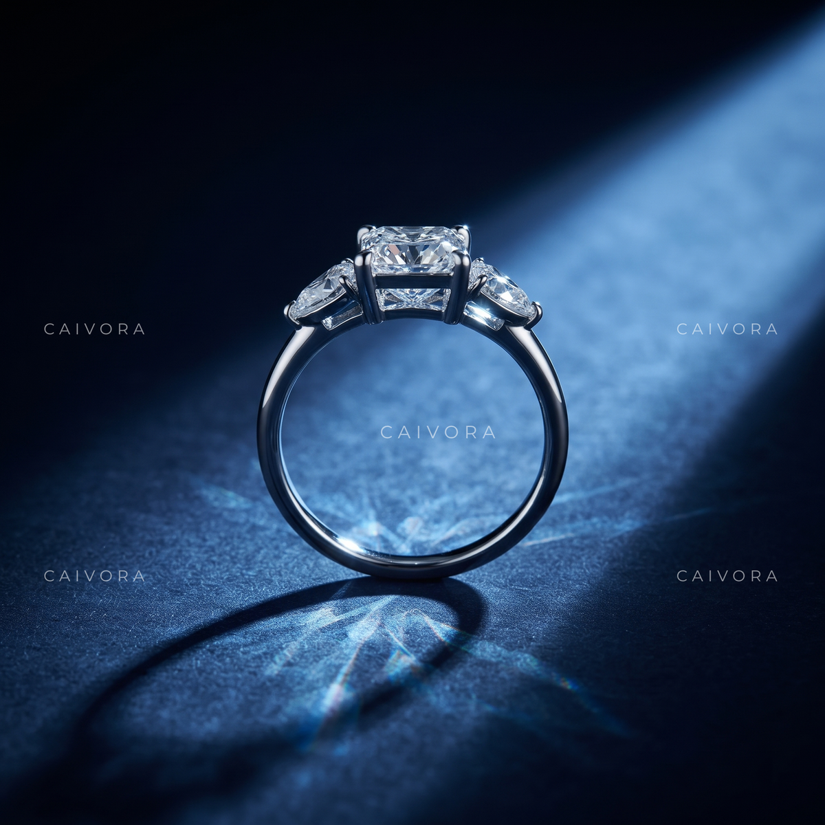 Refined Three Stone Setting Framed by a Radiant Cut Center Diamond