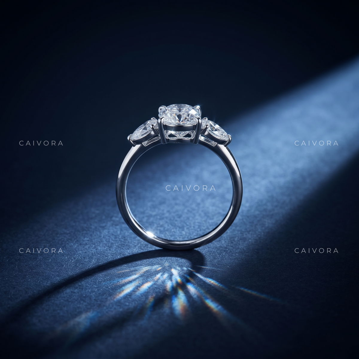 Graceful Three Stone Silhouette with an Moval Cut Center