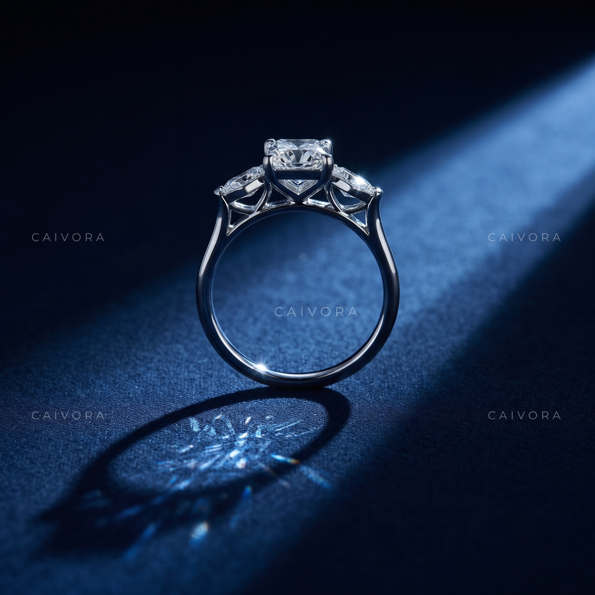 Contemporary Three Stone Engagement Ring with Emerald Diamond & Kite Accents