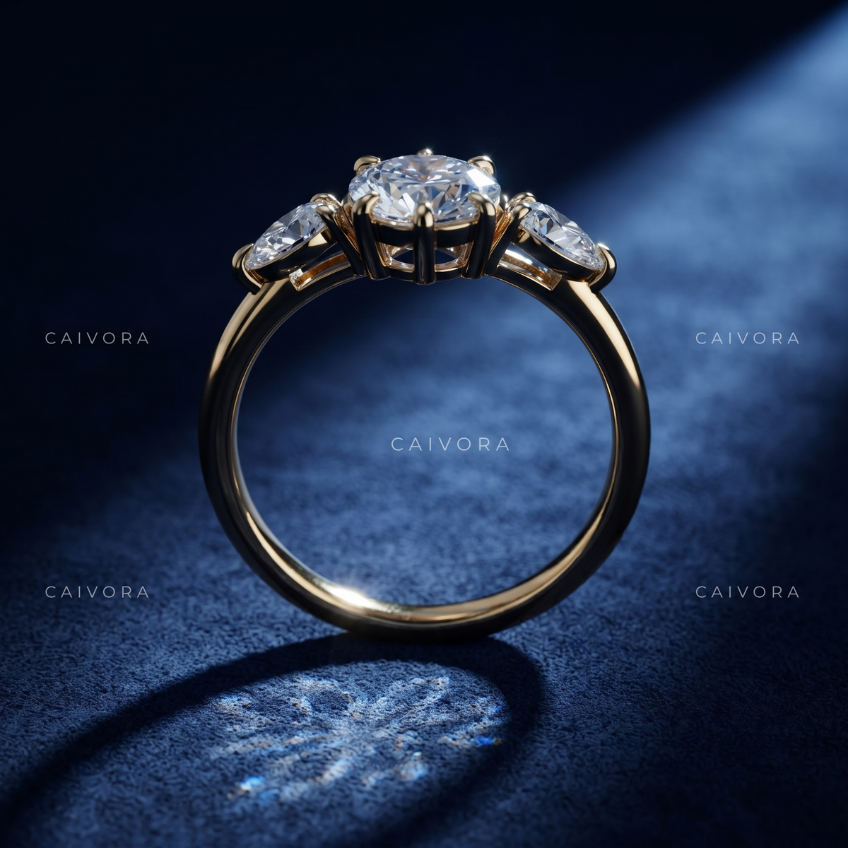 Elegant Three Stone Diamond Setting with a Pear Cut Center
