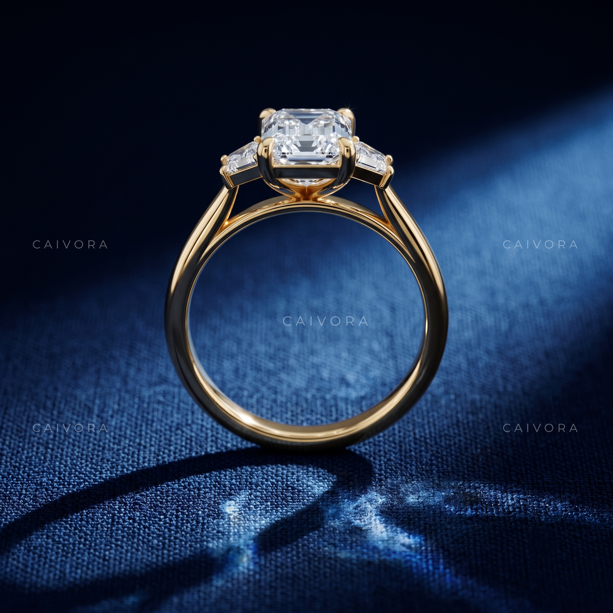 Modern Three Stone Engagement Ring with Emerald Diamond & Trapezoid Accents