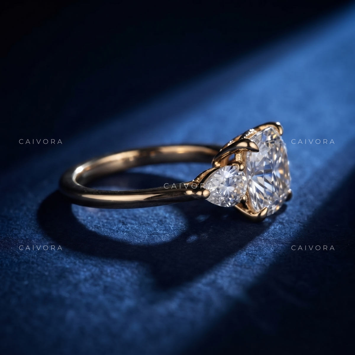 Graceful Three Stone Diamond Ring Featuring a Cushion Cut Center