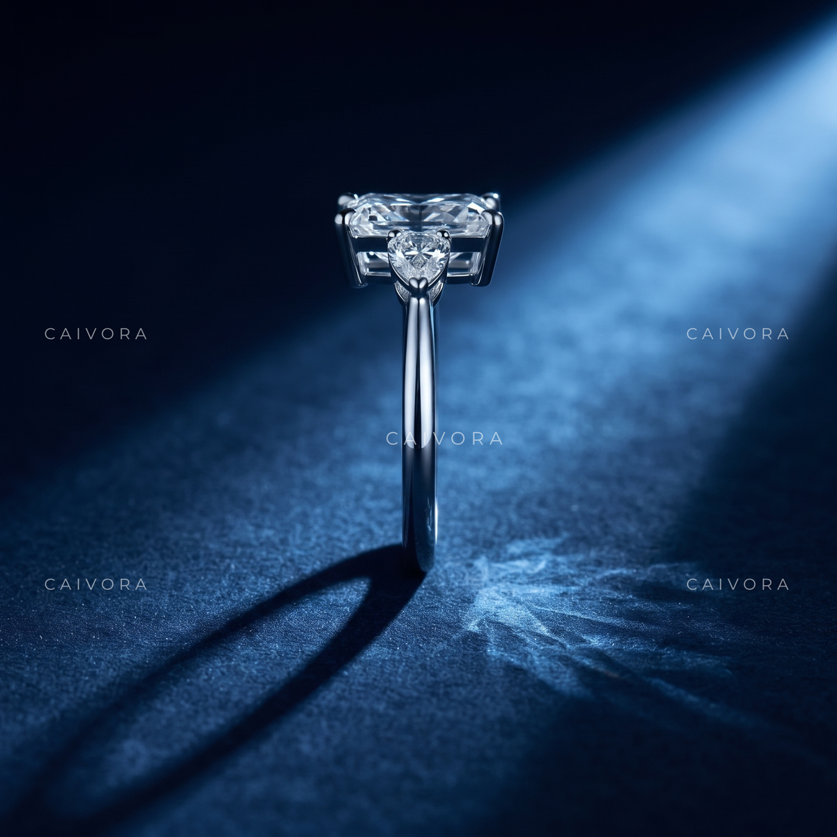 Refined Three Stone Setting Framed by a Radiant Cut Center Diamond