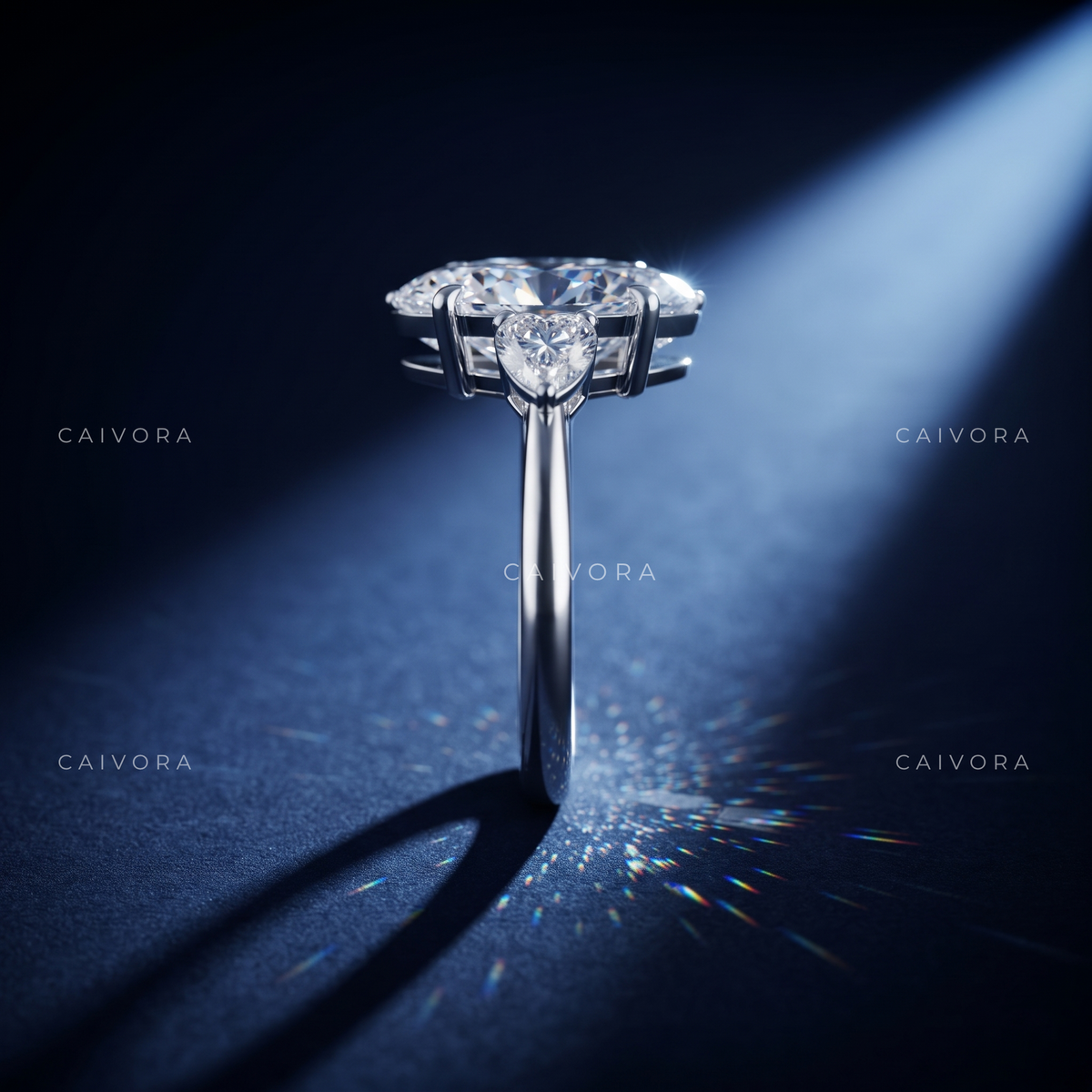 Graceful Three Stone Silhouette with an Moval Cut Center