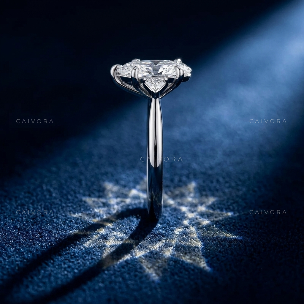 Elegant Three Stone Engagement Ring with Pear Diamond & Kite Accents