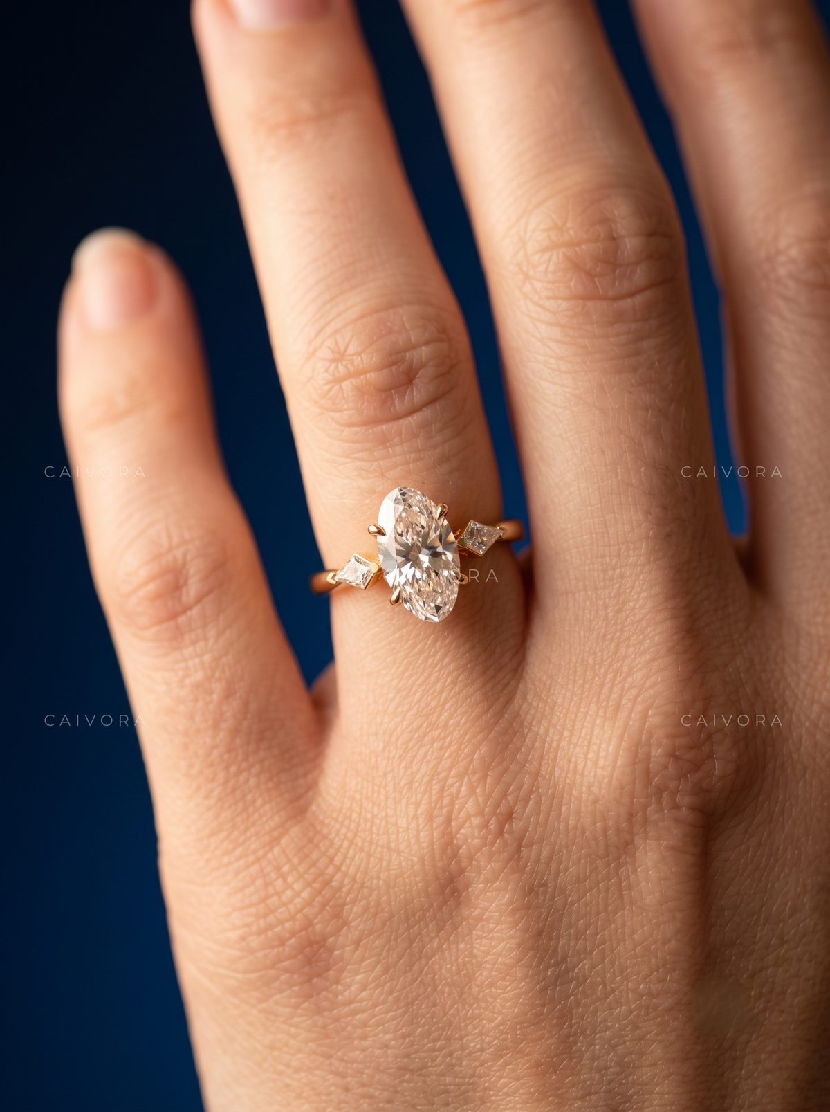 Refined Three Stone Engagement Ring with Moval Diamond & Kite Accents
