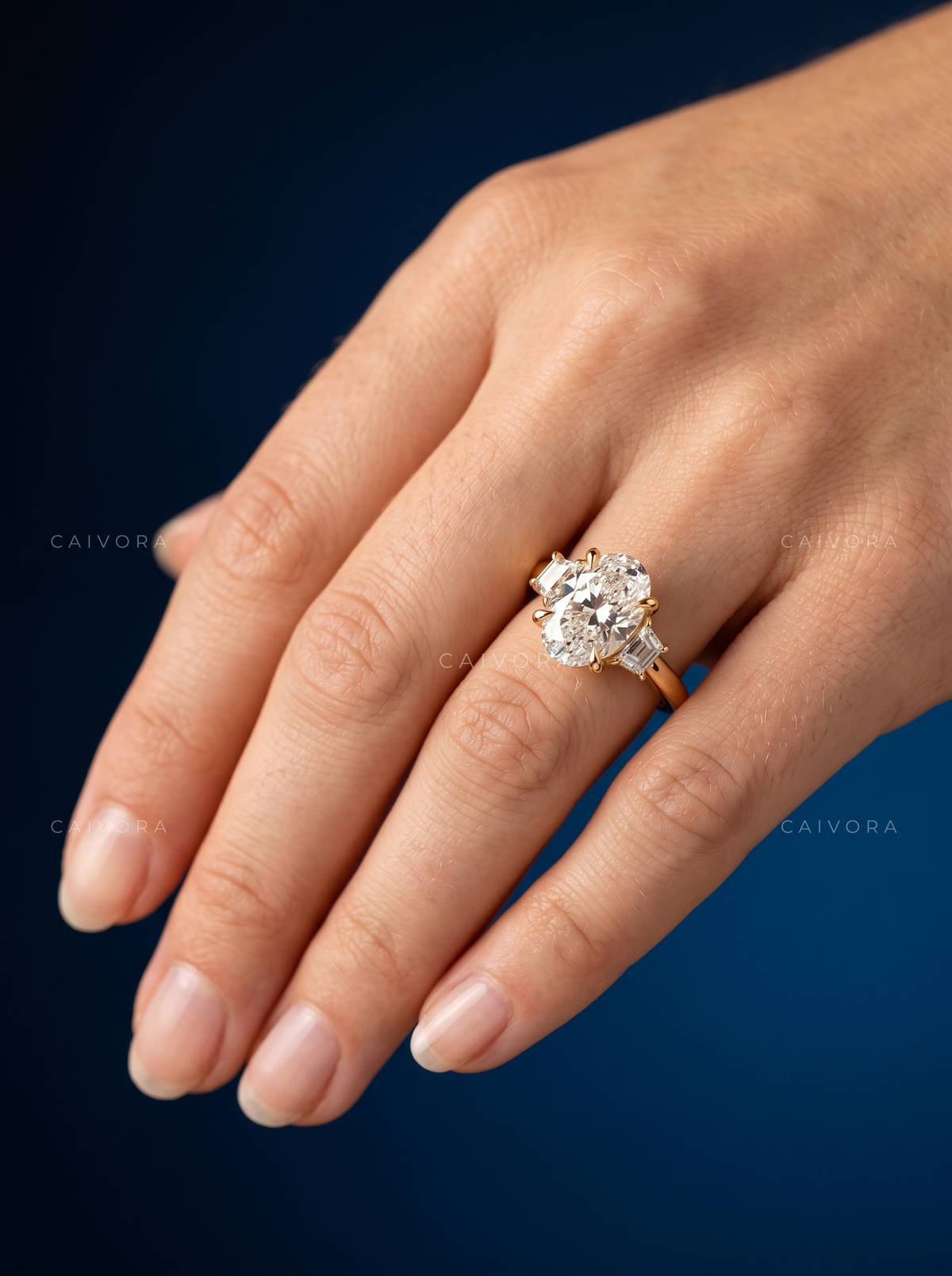 Oval Diamond Three Stone Engagement Ring with Trapezoid Accents