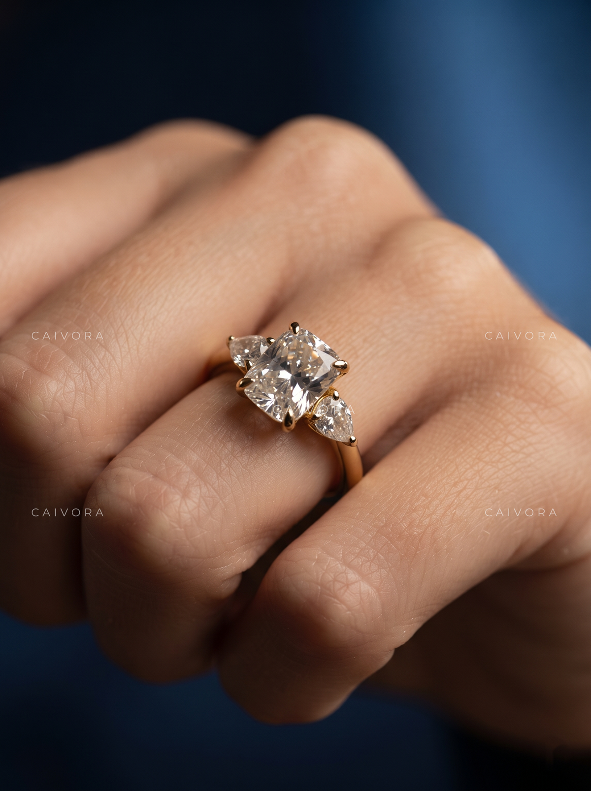 Romantic Three Stone Engagement Ring with a Cushion Cut Center