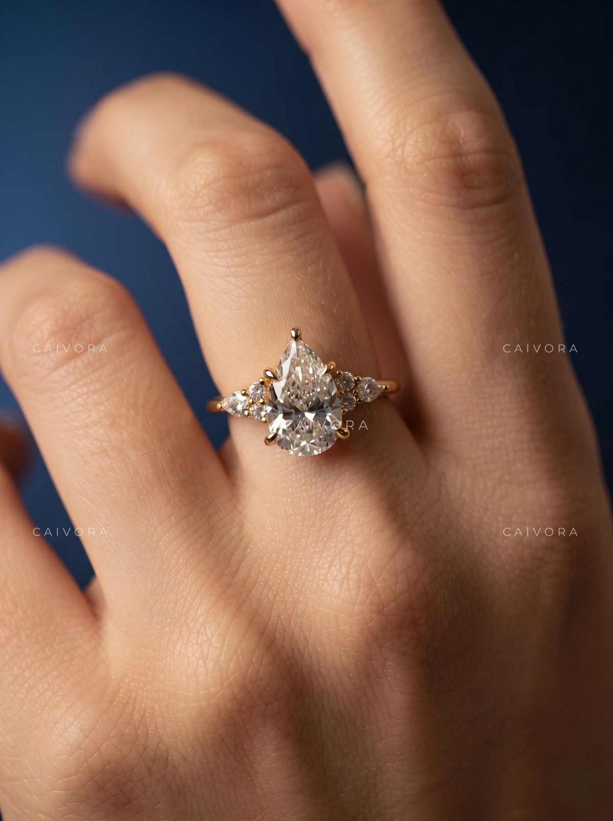 Elegant Latin-Inspired Engagement Ring with a Pear Cut Center Stone
