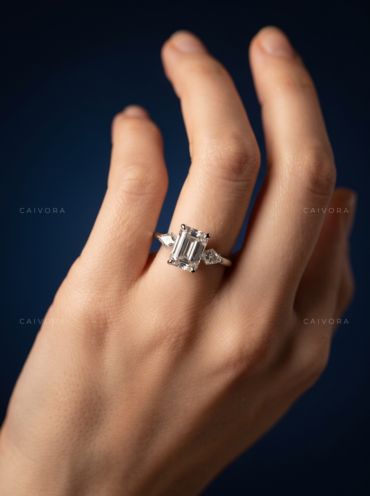 Contemporary Three Stone Engagement Ring with Emerald Diamond & Kite Accents