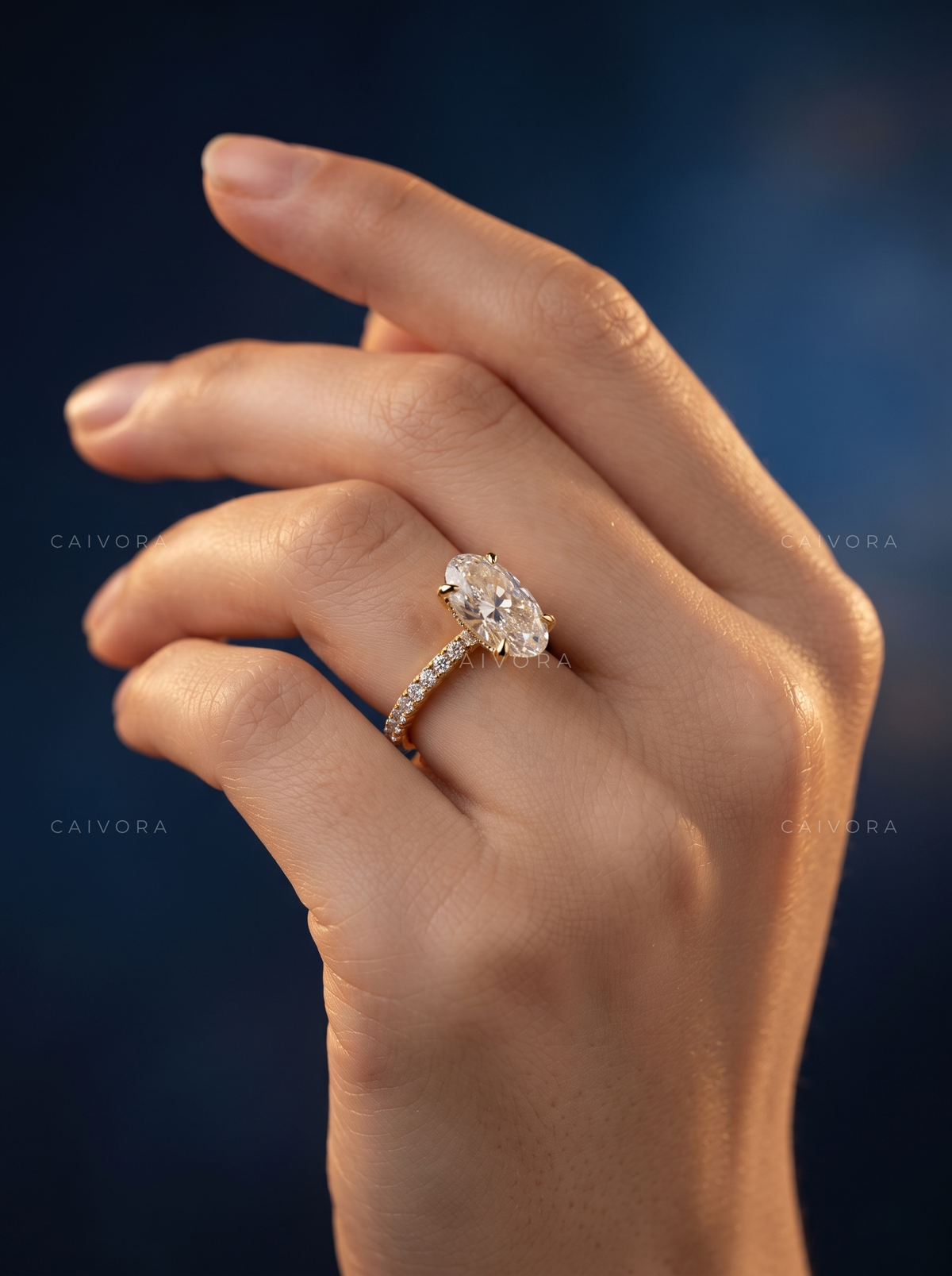 Moval Cut Diamond Engagement Ring with Brilliant Pave Accents