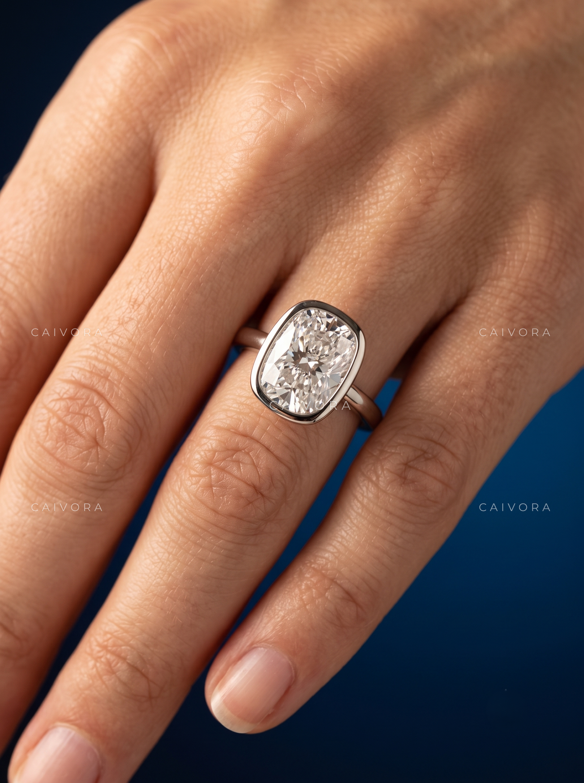 Sculpted Grace with an Elongated Cushion Cut Center
