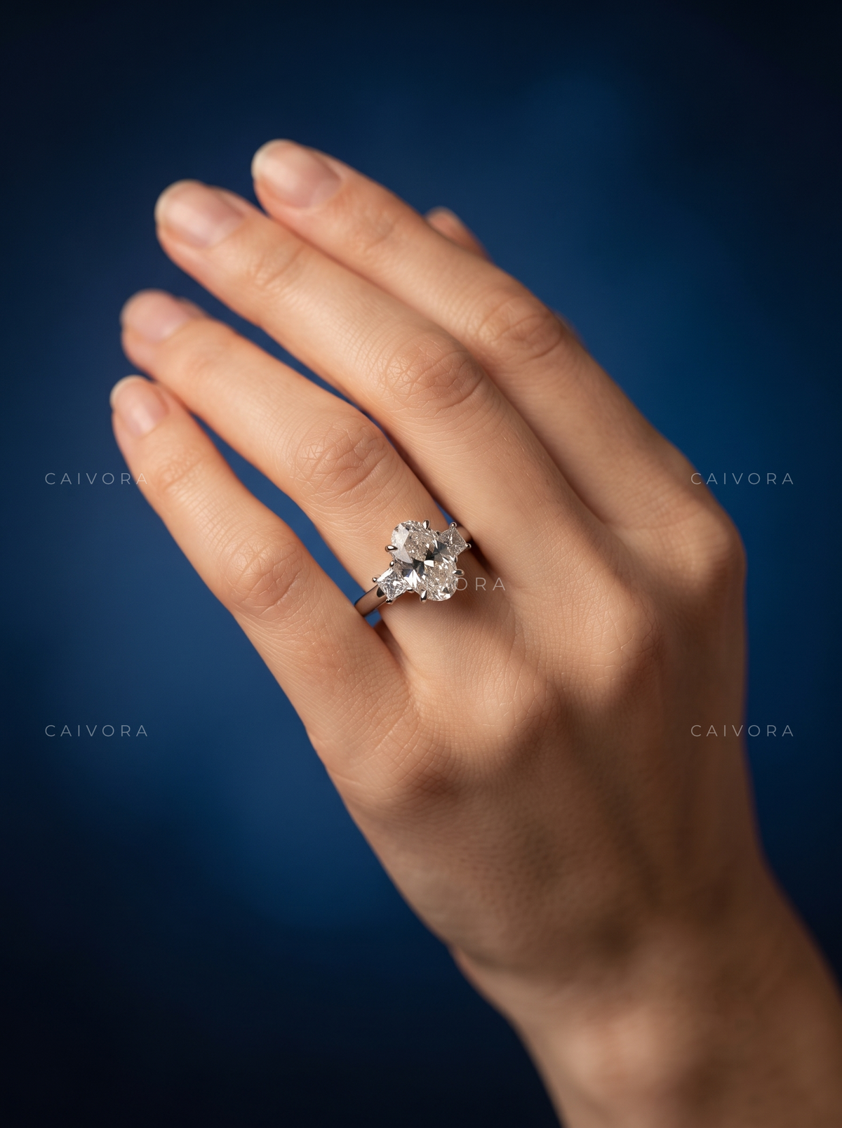 Elegant Three Stone Engagement Ring with Moval Diamond & Trapezoid Accents
