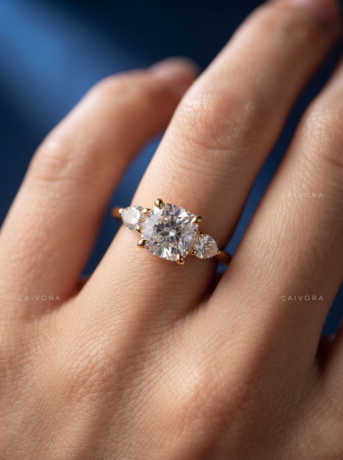 Graceful Three Stone Diamond Ring Featuring a Cushion Cut Center