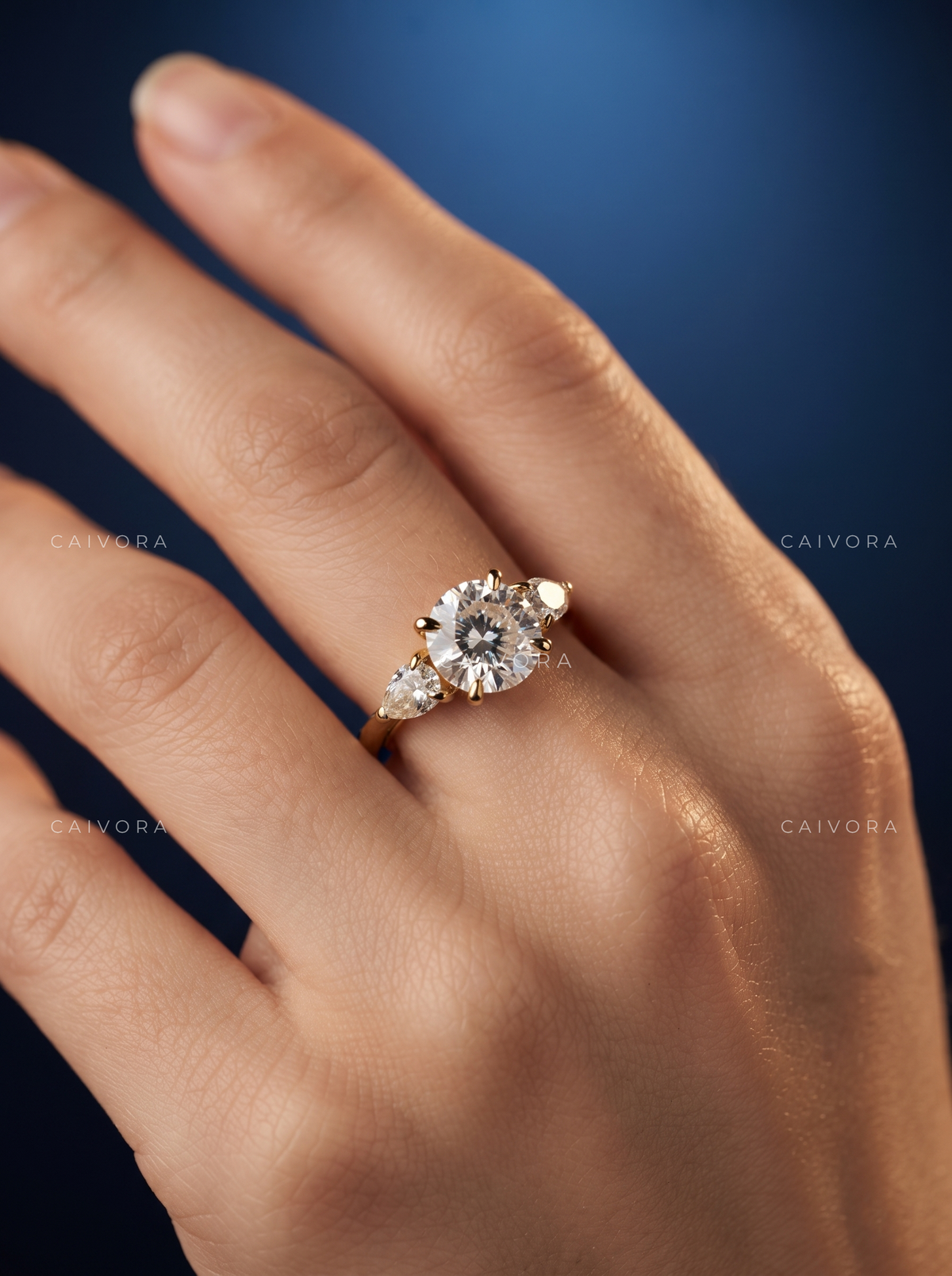 Brilliant Round Cut Center in a Distinctive Three Stone Diamond Ring