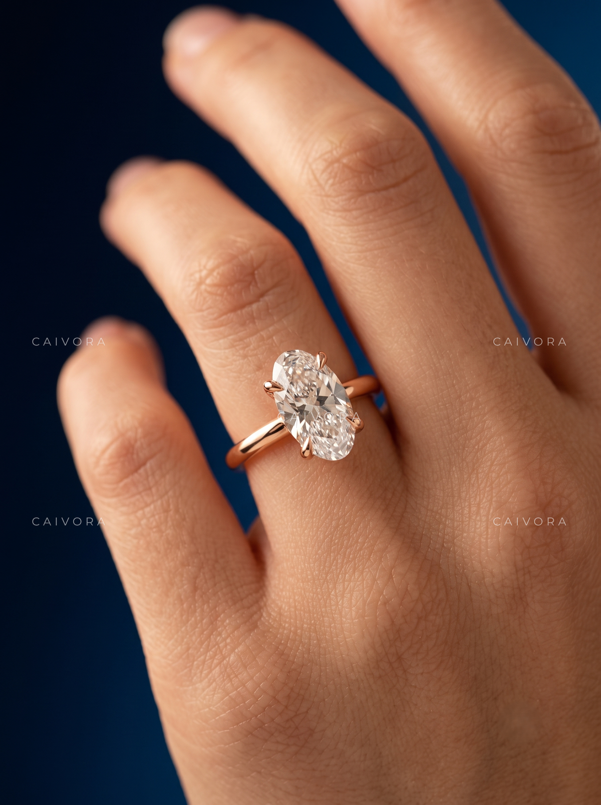 Moval Cut Four Prong Solitaire Engagement Ring