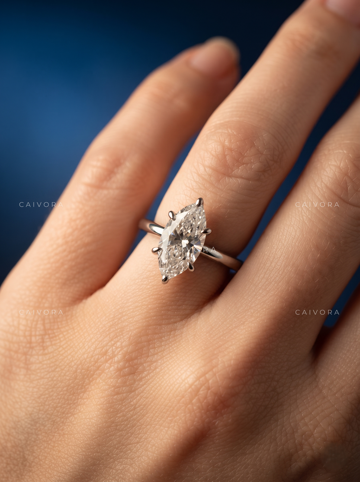 Distinctive Tapered Cathedral Engagement Ring with a Marquise Cut Diamond