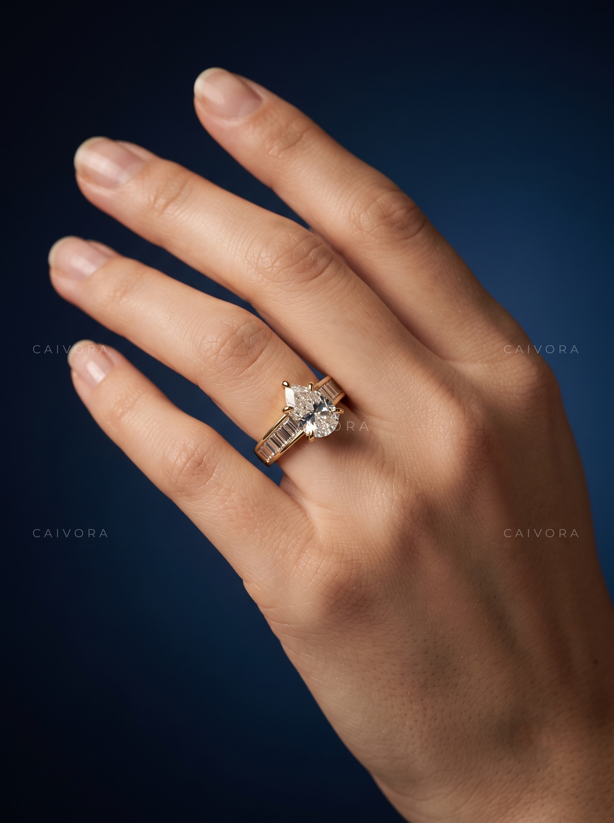 Pear Shaped Diamond Channel Setting Engagement Ring with Baguette Accents