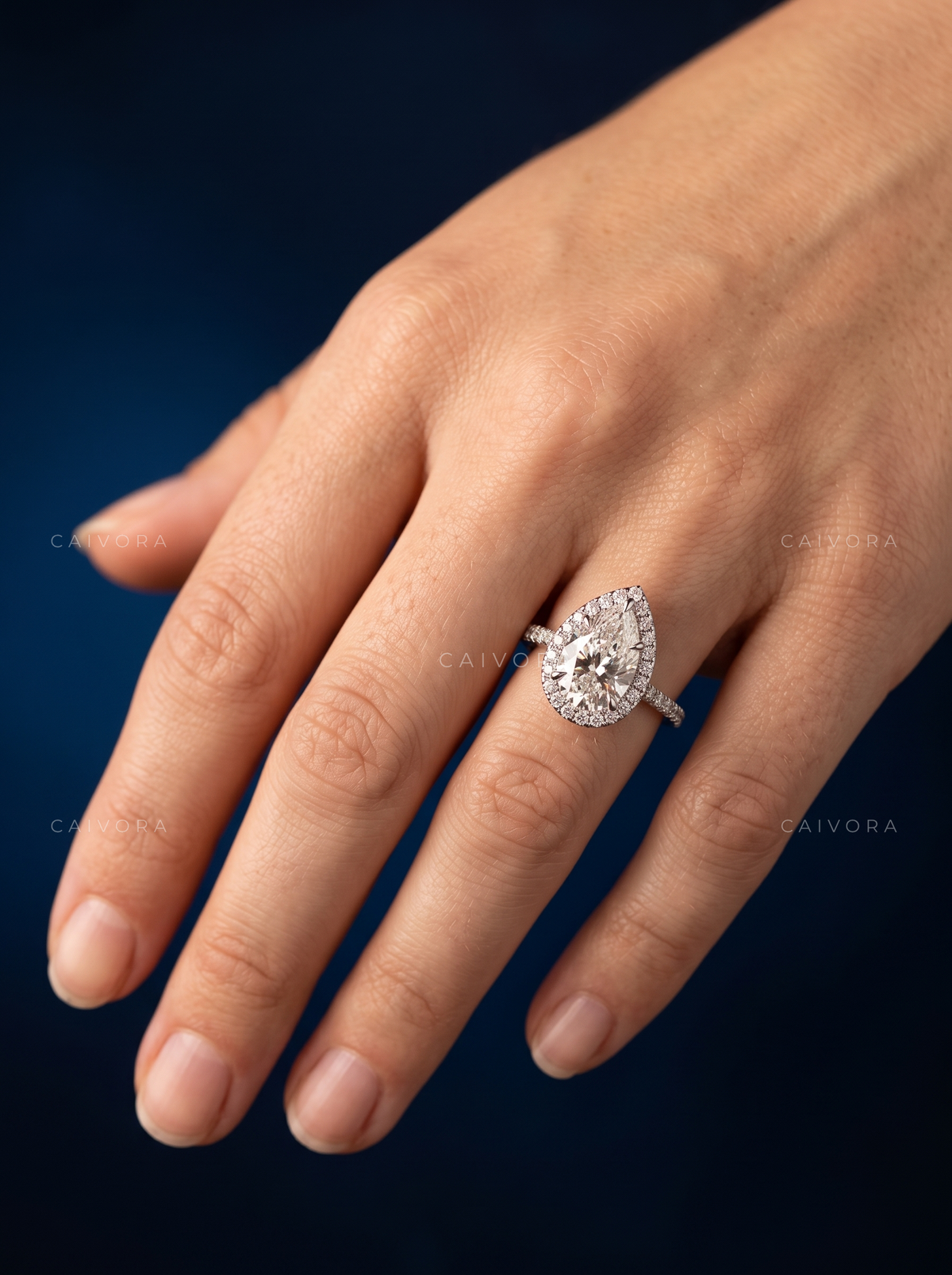 Elegant Halo Engagement Ring with Pear Diamond & Pavé Accents