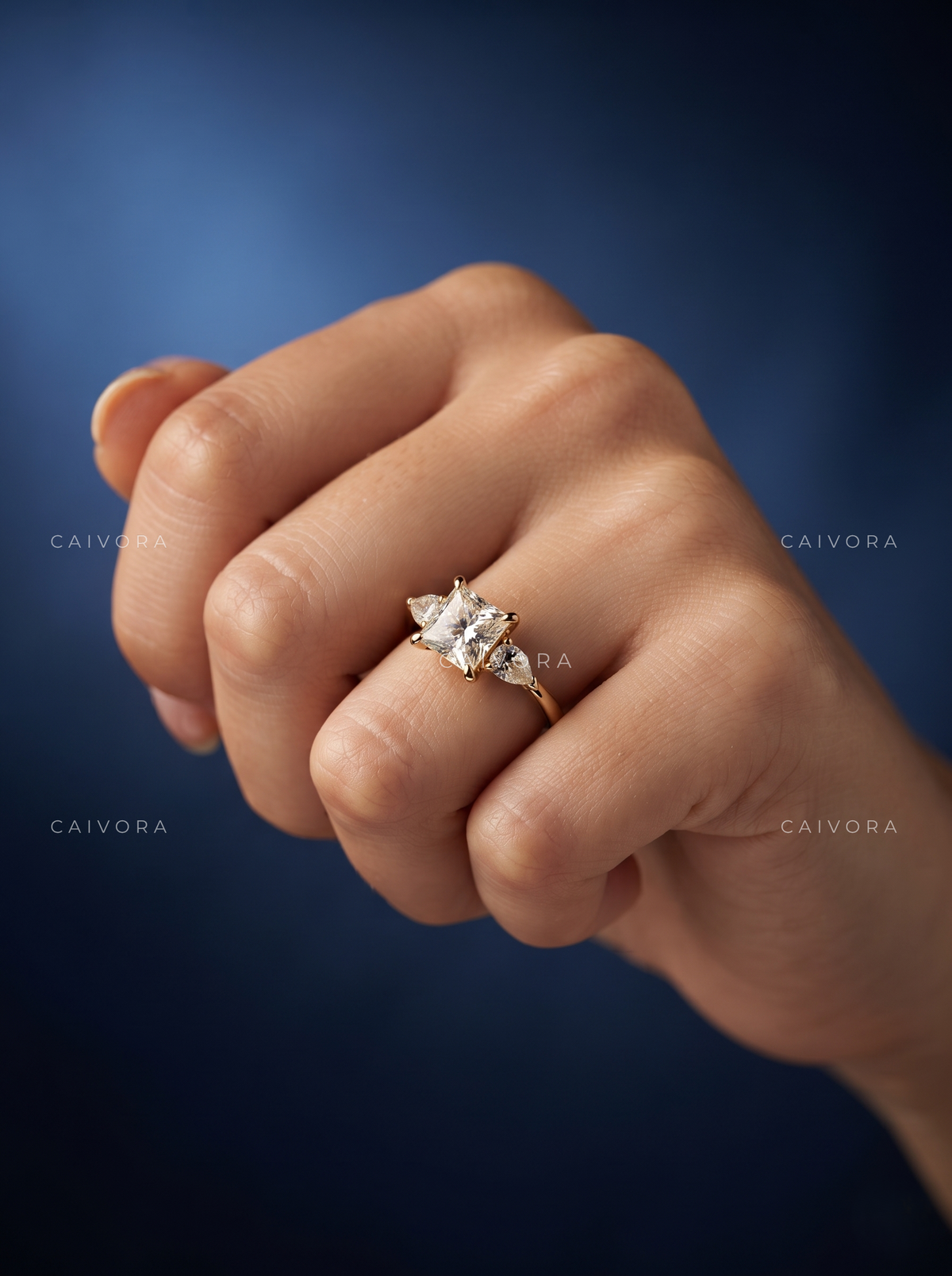 Vintage Inspired Three Stone Setting with an princess cut Center