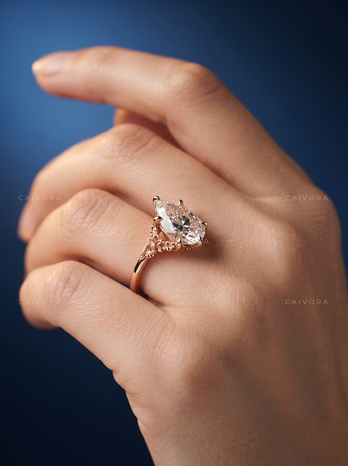 Roselle Contour Ring with a Pear-Shaped Diamond