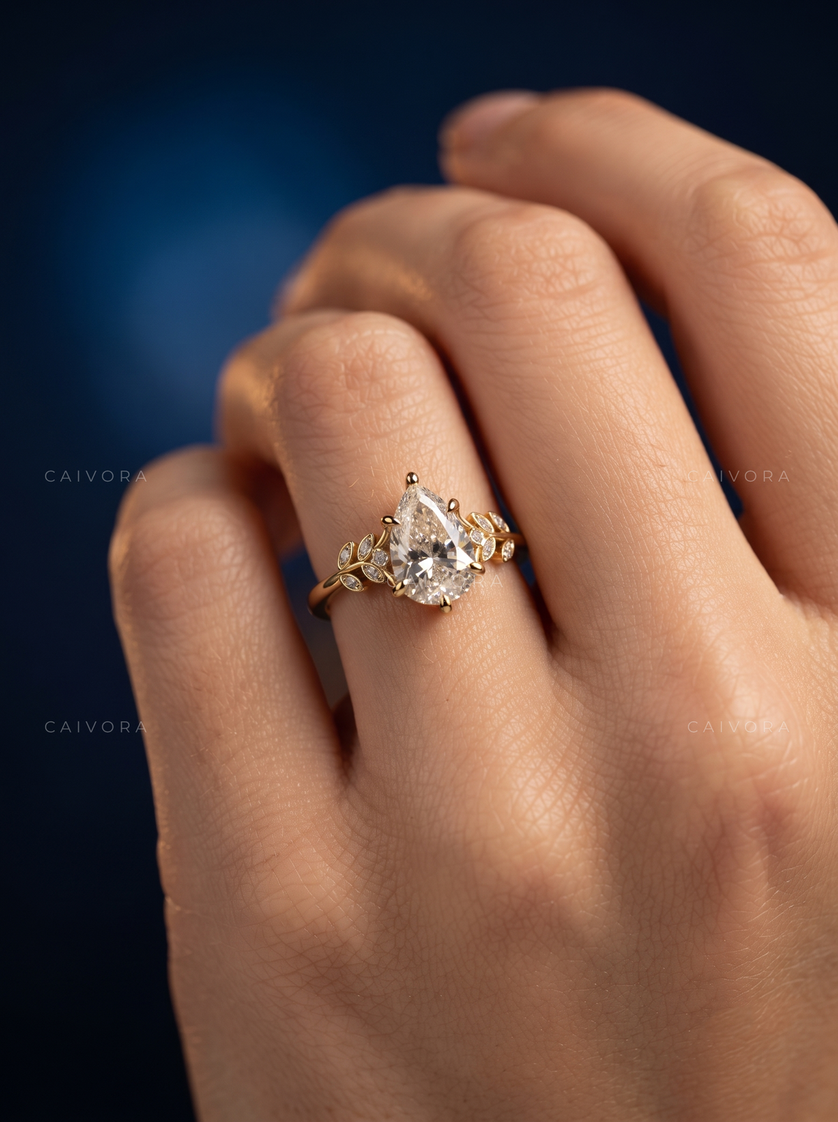 Pear Shaped Diamond Floral Engagement Ring with Marquise Accents