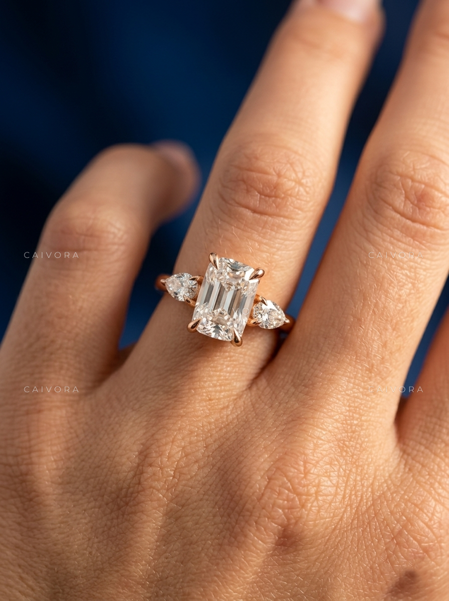 Romantic Three Stone Design Framed by a Cushion Cut Center