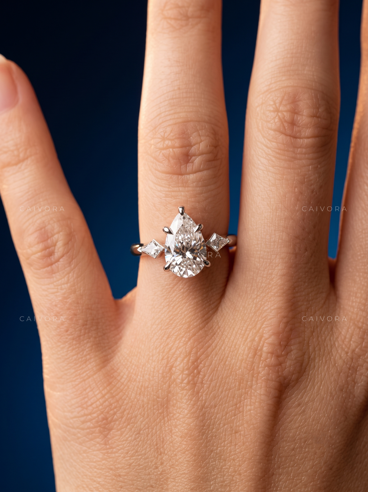 Elegant Three Stone Engagement Ring with Pear Diamond & Kite Accents