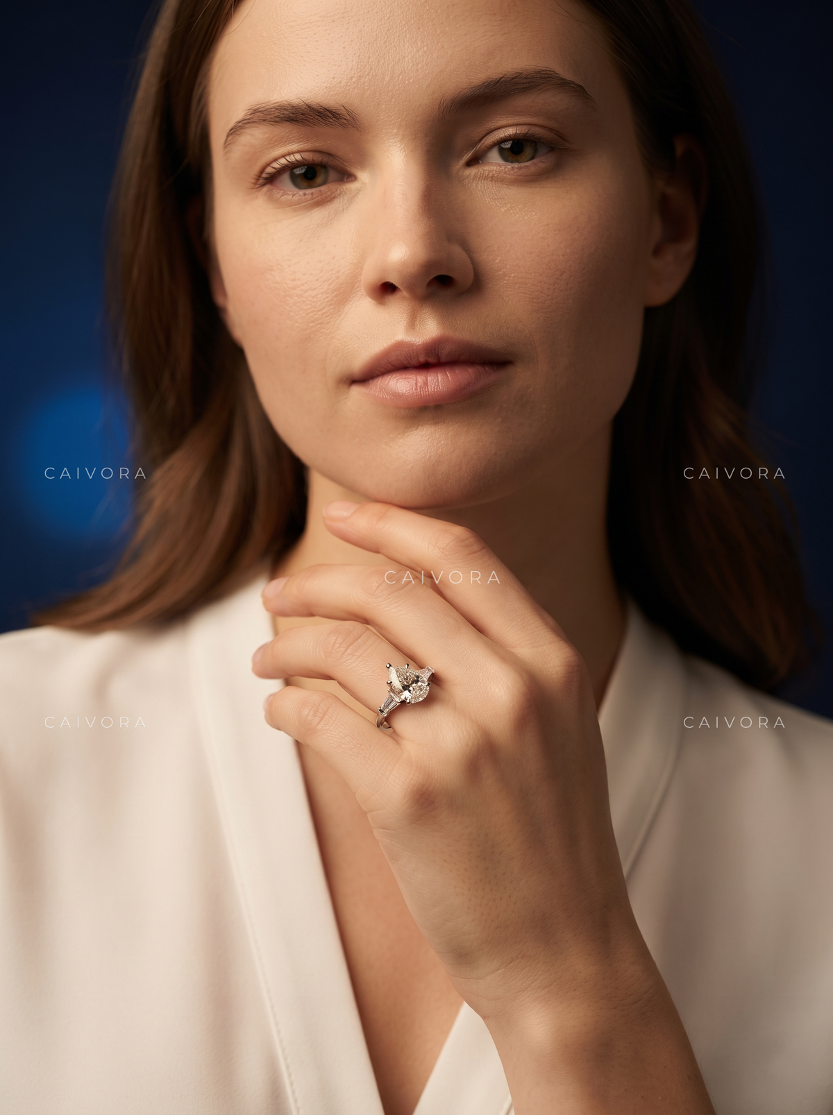 Graceful Contours with a Pear Cut Center Diamond