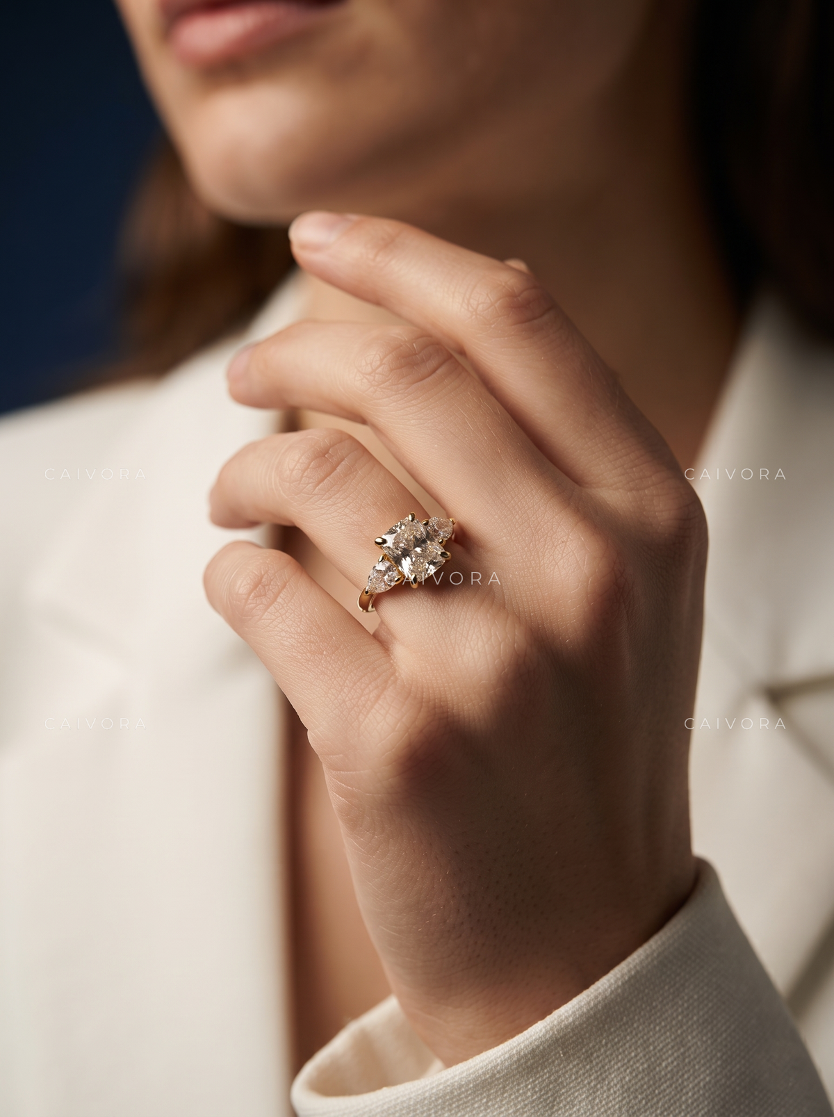 Romantic Three Stone Engagement Ring with a Cushion Cut Center