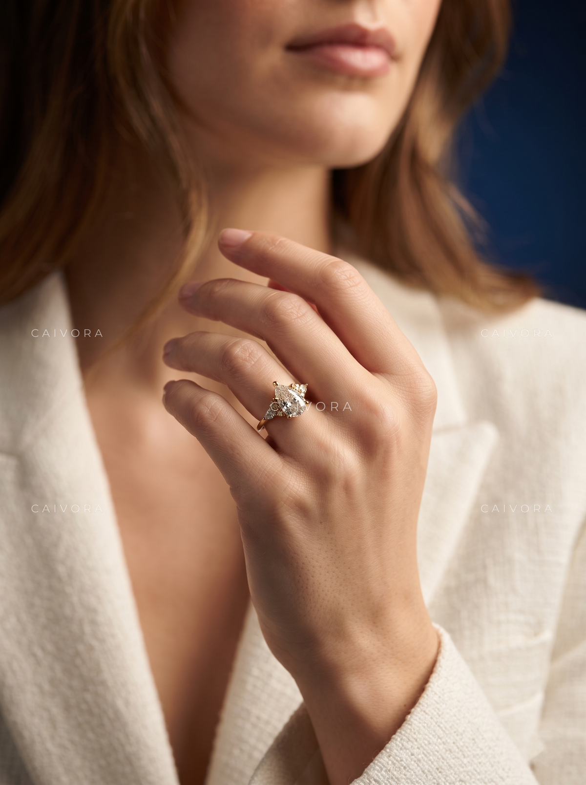 Elegant Latin-Inspired Engagement Ring with a Pear Cut Center Stone