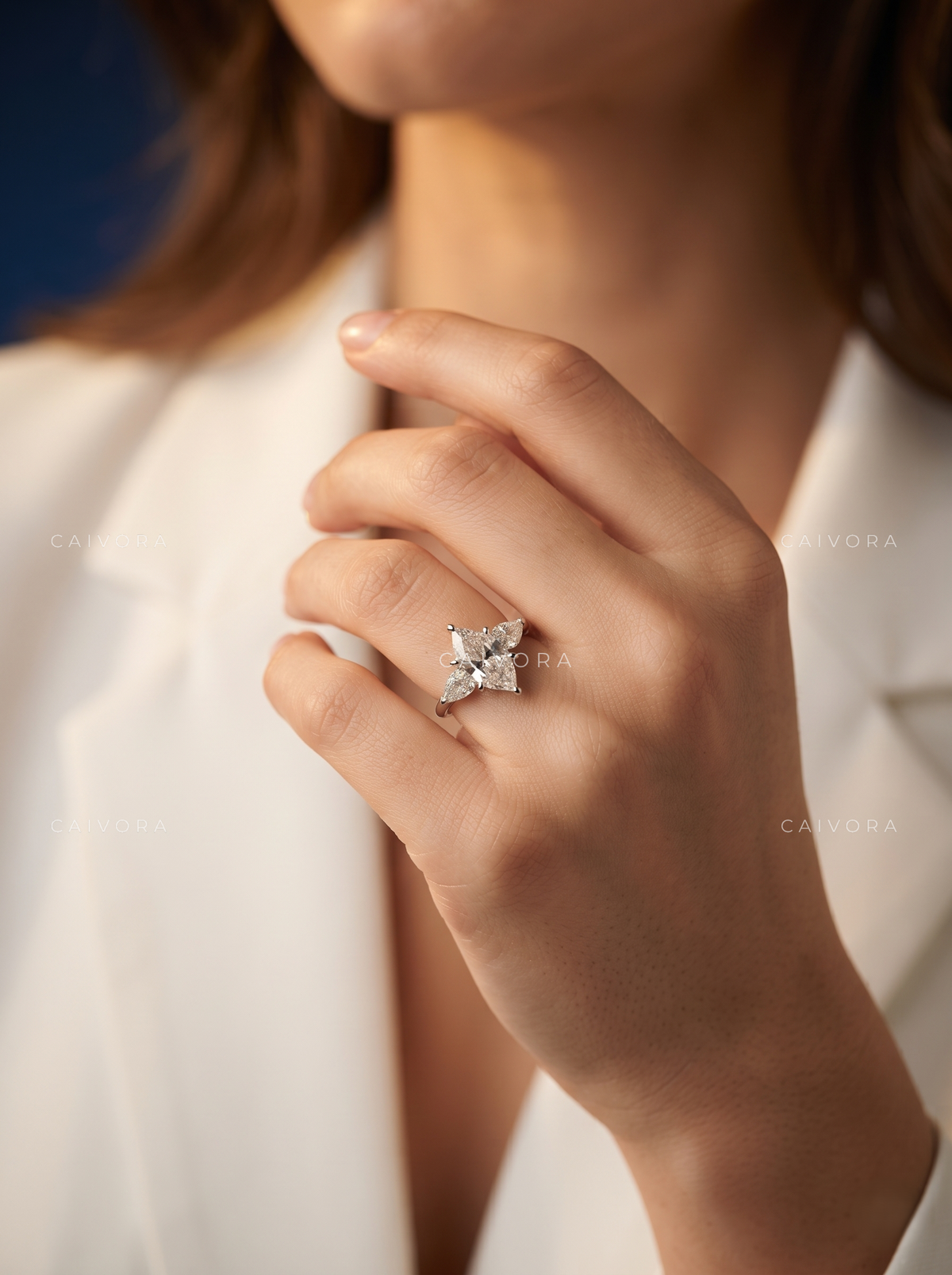 A Distinctive Three Stone Setting Featuring a Hexagon Cut Center
