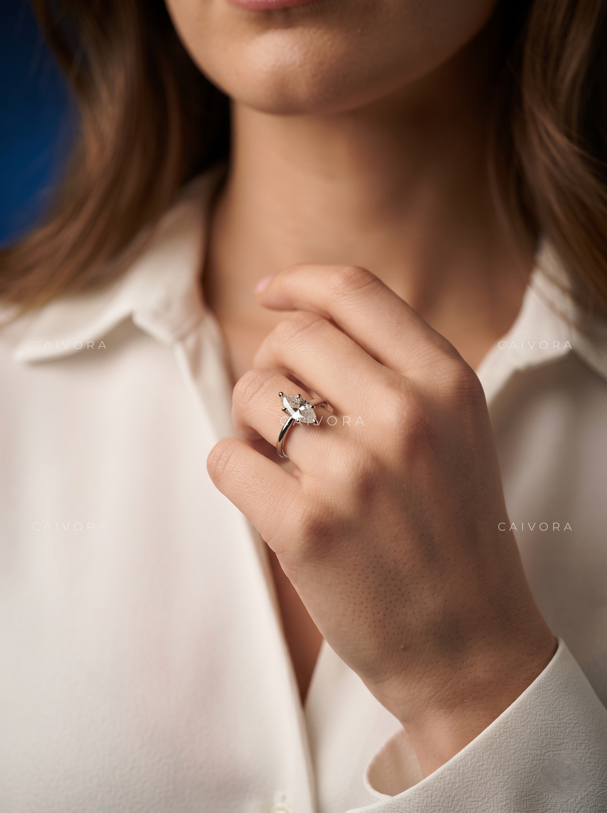 Distinctive Tapered Cathedral Engagement Ring with a Marquise Cut Diamond
