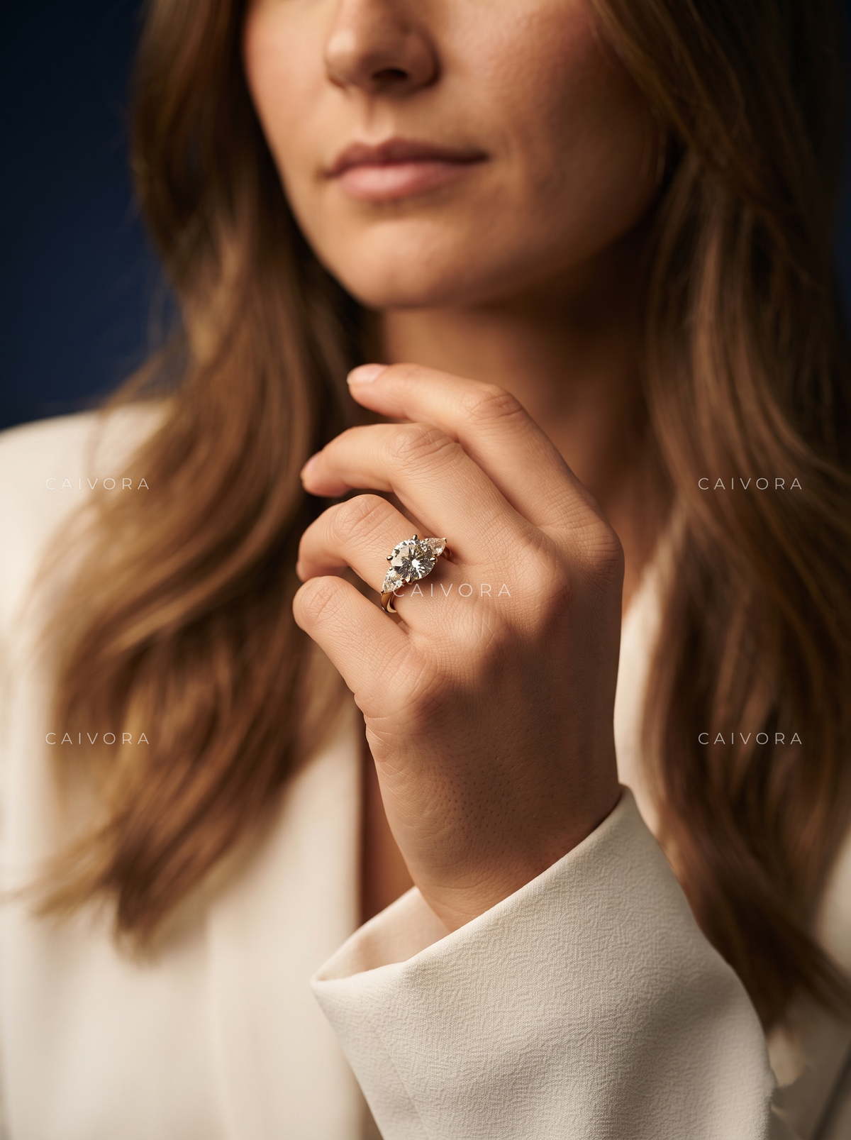Brilliant Round Cut Center in a Distinctive Three Stone Diamond Ring