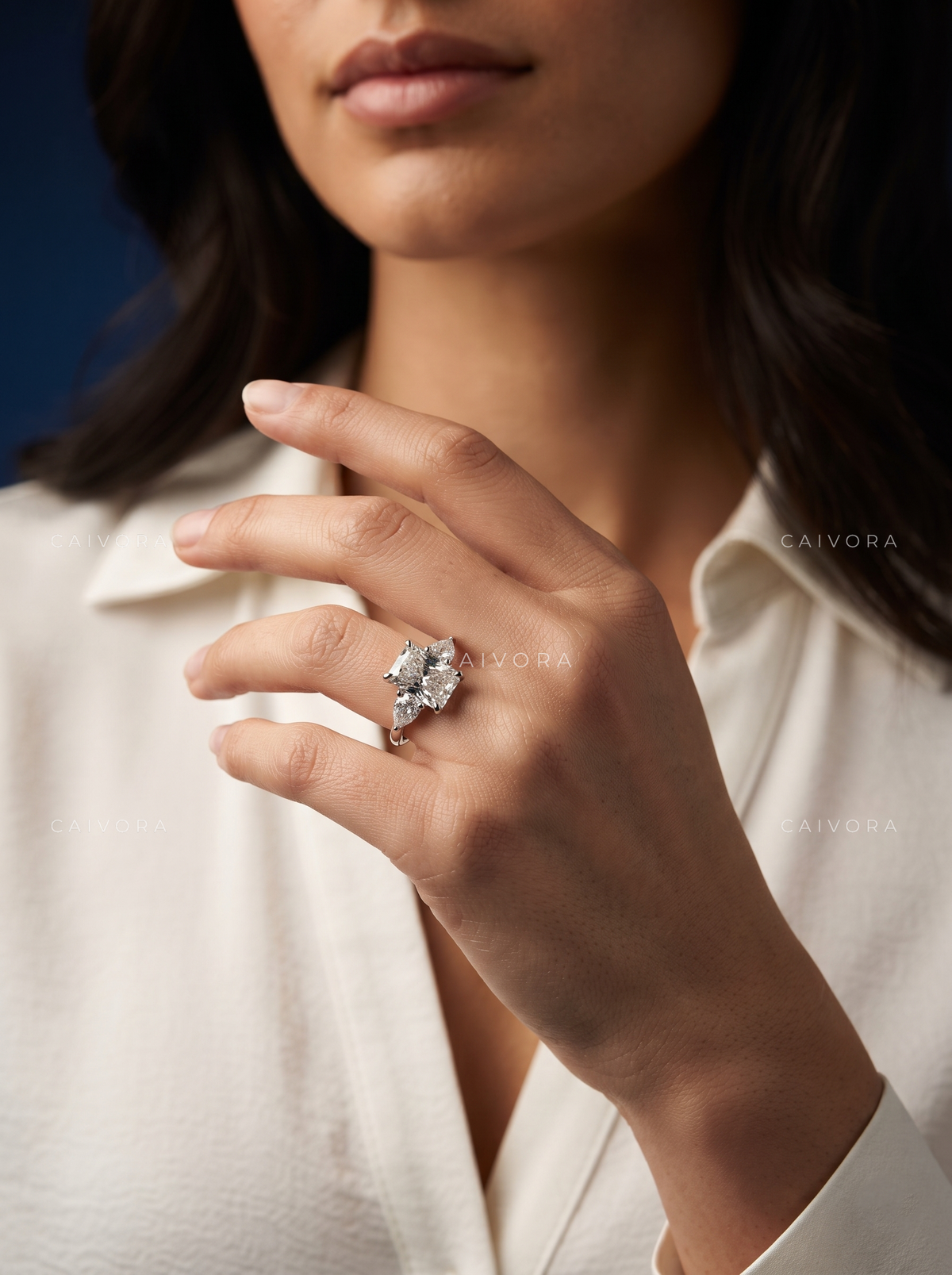 Refined Three Stone Setting Framed by a Radiant Cut Center Diamond